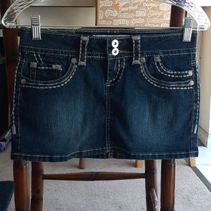 Hydraulic dark wash mini skirt